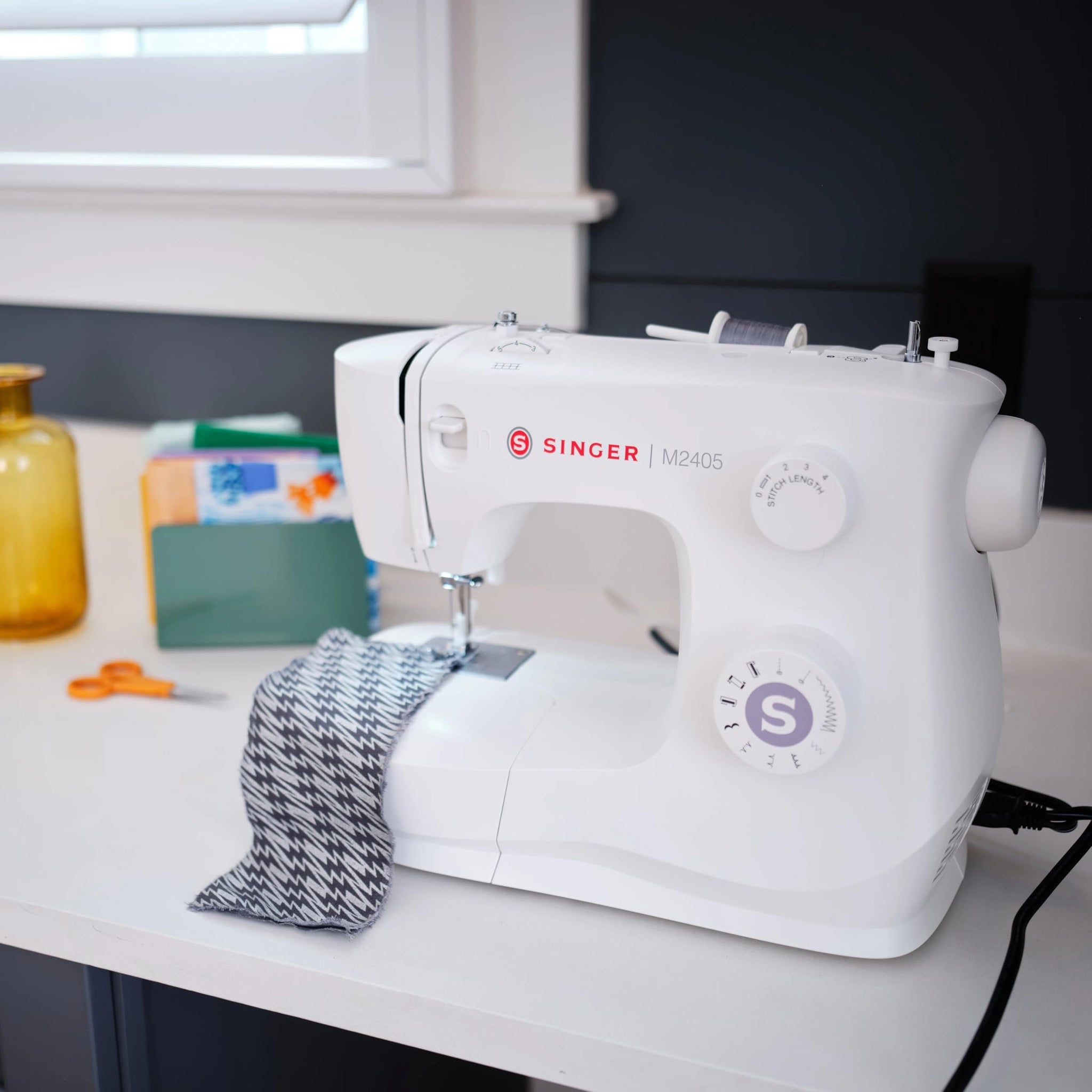 Singer M2405 Portable Sewing Machine, 8 Built-in Stitches, 4 Step Buttonhole, Foot Controller, Stitch Selection Dial, LED Light, Adjustable Stitch Length, Free Arm, Accessories Kit